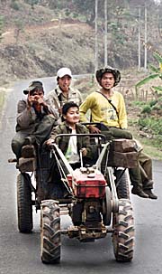 Four Laotian Adolescents on a Tractor by Asienreisender